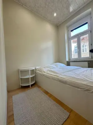 Ein Bett oder Betten in einem Zimmer der Unterkunft Stadthalle charmante Wohnung