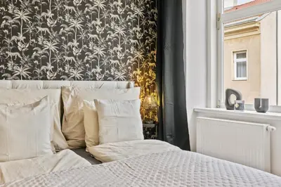 Ein Bett oder Betten in einem Zimmer der Unterkunft Apartment Botanika