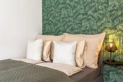 Ein Bett oder Betten in einem Zimmer der Unterkunft Apartment Botanika