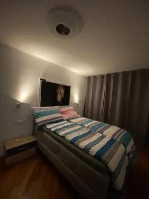 Ein Bett oder Betten in einem Zimmer der Unterkunft NeicApartmentLandskron 1010