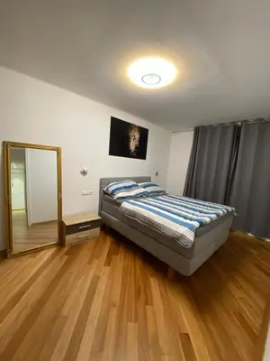 Ein Bett oder Betten in einem Zimmer der Unterkunft NeicApartmentLandskron 1010