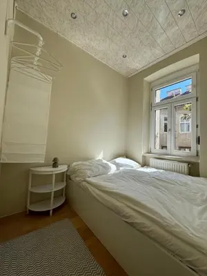 Ein Bett oder Betten in einem Zimmer der Unterkunft Charmante zentral gelegene Wohnung