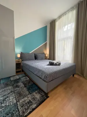 Ein Bett oder Betten in einem Zimmer der Unterkunft Delightful Suite Westbahnhof