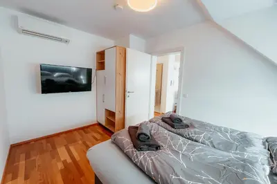 Ein Bett oder Betten in einem Zimmer der Unterkunft Danube Rooftop Apartment 15