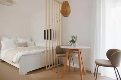 Ein Bett oder Betten in einem Zimmer der Unterkunft BOHO Studio with Terrace - Augarten - 10 min to Center