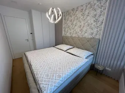 Ein Bett oder Betten in einem Zimmer der Unterkunft Green Park Apartment