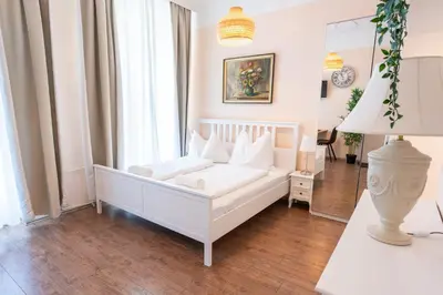 Ein Bett oder Betten in einem Zimmer der Unterkunft Hotel Schönbrunn by Vienna Living Apartments