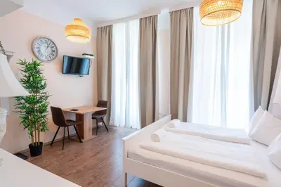 Ein Bett oder Betten in einem Zimmer der Unterkunft Hotel Schönbrunn by Vienna Living Apartments