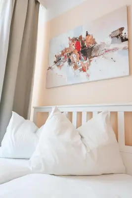 Ein Bett oder Betten in einem Zimmer der Unterkunft Hotel Schönbrunn by Vienna Living Apartments