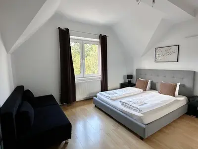 Ein Bett oder Betten in einem Zimmer der Unterkunft Up Residences S