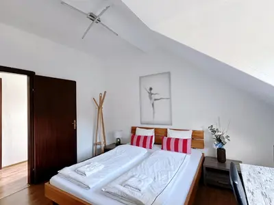 Ein Bett oder Betten in einem Zimmer der Unterkunft Up Residences S