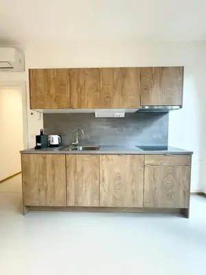 Küche/Küchenzeile in der Unterkunft Möbliertes Apartment mit Terrasse