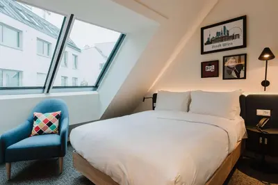 Ein Bett oder Betten in einem Zimmer der Unterkunft Hampton By Hilton Vienna City West