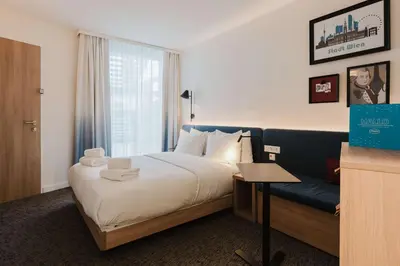 Ein Bett oder Betten in einem Zimmer der Unterkunft Hampton By Hilton Vienna City West
