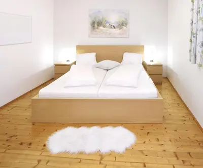 Ein Bett oder Betten in einem Zimmer der Unterkunft Urbanihof in Jois