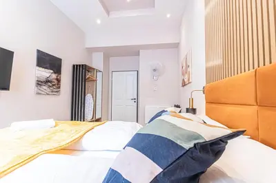 Ein Bett oder Betten in einem Zimmer der Unterkunft Wiener Stadthalle Boutique Rooms - ideal for couples