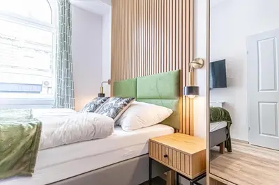 Ein Bett oder Betten in einem Zimmer der Unterkunft Wiener Stadthalle Boutique Rooms - ideal for couples