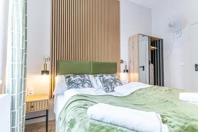 Ein Bett oder Betten in einem Zimmer der Unterkunft Wiener Stadthalle Boutique Rooms - ideal for couples