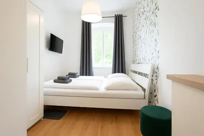 Ein Bett oder Betten in einem Zimmer der Unterkunft DAINN Apartments Schönbrunn