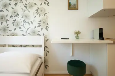 Ein Bett oder Betten in einem Zimmer der Unterkunft DAINN Apartments Schönbrunn