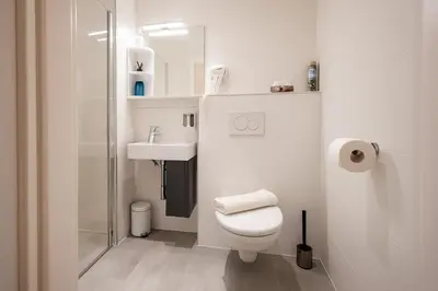 Ein Badezimmer in der Unterkunft DAINN Apartments Schönbrunn
