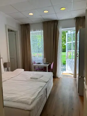 Ein Bett oder Betten in einem Zimmer der Unterkunft Apartment mit Gartenblick und Terrasse