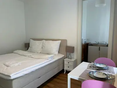 Ein Bett oder Betten in einem Zimmer der Unterkunft Apartment mit Gartenblick und Terrasse