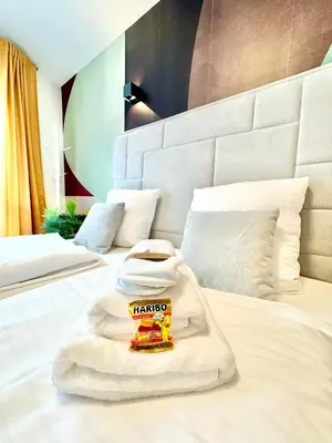 Ein Bett oder Betten in einem Zimmer der Unterkunft Designer Wohnung mit Balkon
