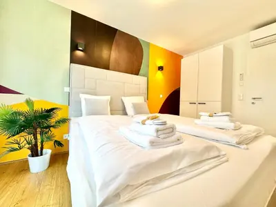 Ein Bett oder Betten in einem Zimmer der Unterkunft Designer Wohnung mit Balkon