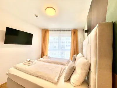 Ein Bett oder Betten in einem Zimmer der Unterkunft Designer Wohnung mit Balkon