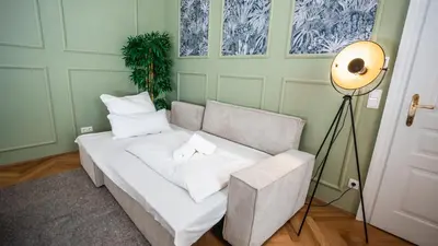 Ein Bett oder Betten in einem Zimmer der Unterkunft Erstklassiges Apartment in Schloss Nähe