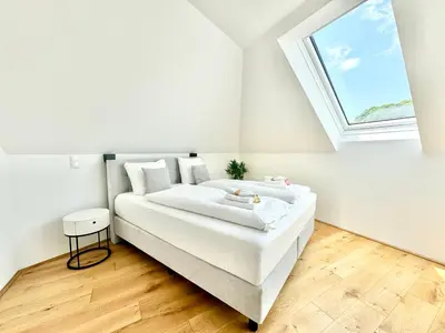 Ein Bett oder Betten in einem Zimmer der Unterkunft Wohnung mit Balkon