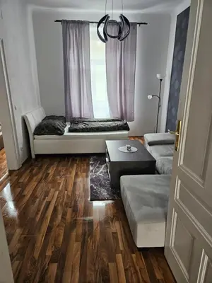 Ein Bett oder Betten in einem Zimmer der Unterkunft Gold Appartman