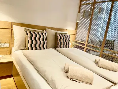 Ein Bett oder Betten in einem Zimmer der Unterkunft TheWICKI 10 - Wunderschöne Apartments in Wien