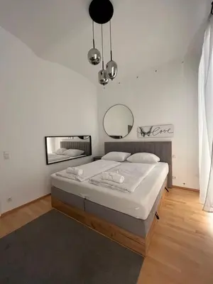 Ein Bett oder Betten in einem Zimmer der Unterkunft Luxury CityApartment 5