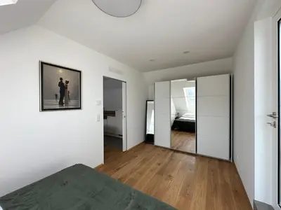 Ein Bett oder Betten in einem Zimmer der Unterkunft FeelHome-Dachterrasse-4 Gäste-WiFi