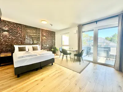 Ein Bett oder Betten in einem Zimmer der Unterkunft Chillige Wohnung mit Balkon