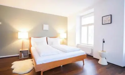 Ein Bett oder Betten in einem Zimmer der Unterkunft Authentic Austrian Flat in the South of Vienna