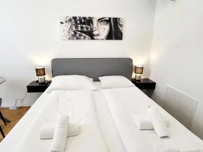 Ein Bett oder Betten in einem Zimmer der Unterkunft Neulerchenfelder City Apartment