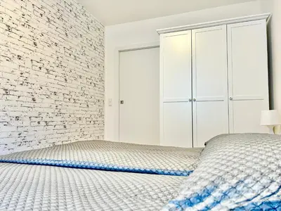 Ein Bett oder Betten in einem Zimmer der Unterkunft Brand New Central & Modern Apartment