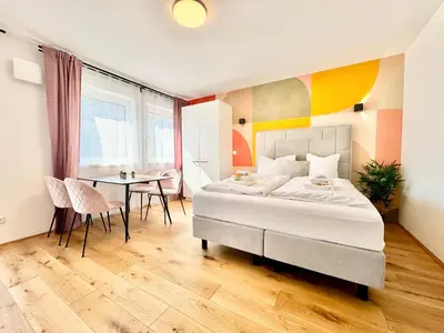 Ein Bett oder Betten in einem Zimmer der Unterkunft Stylische Wohnung mit Balkon