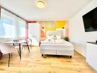 Ein Bett oder Betten in einem Zimmer der Unterkunft Stylische Wohnung mit Balkon
