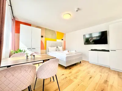 Ein Bett oder Betten in einem Zimmer der Unterkunft Stylische Wohnung mit Balkon