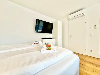 Ein Bett oder Betten in einem Zimmer der Unterkunft Stylische Wohnung mit Balkon