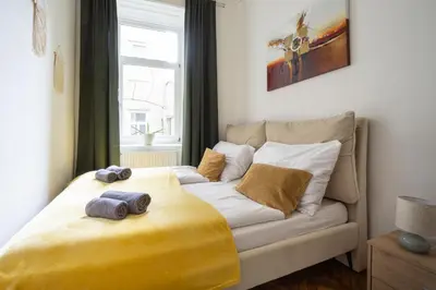 Ein Bett oder Betten in einem Zimmer der Unterkunft Central apartment in Viennese old building
