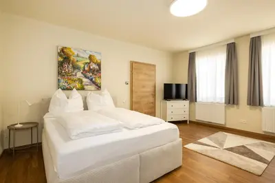 Ein Bett oder Betten in einem Zimmer der Unterkunft KonstantLiving Zillingtal, Apartments mit Elektrotankstelle