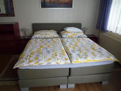 Ein Bett oder Betten in einem Zimmer der Unterkunft Gartenpension Prosl