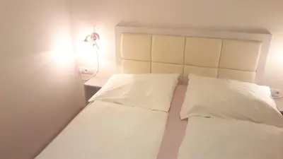 Ein Bett oder Betten in einem Zimmer der Unterkunft Sobieski City Apartments
