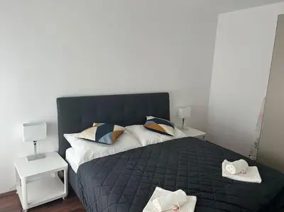 Ein Bett oder Betten in einem Zimmer der Unterkunft Apartment Merkur