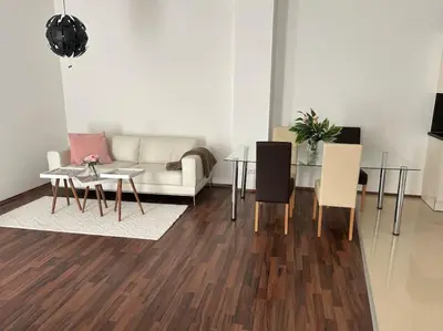 Ein Sitzbereich in der Unterkunft Apartment Merkur